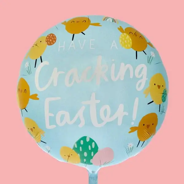 A round light blue Easter balloon decorated with cheerful cartoon chicks, patterned eggs and the text Have a Cracking Easter! on a pink background.